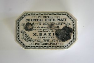 An example of packaging for toothpaste before the collapsible tube was developed. Yes, that toothpaste is made from charcoal. We're curious and, admit it, you are too.